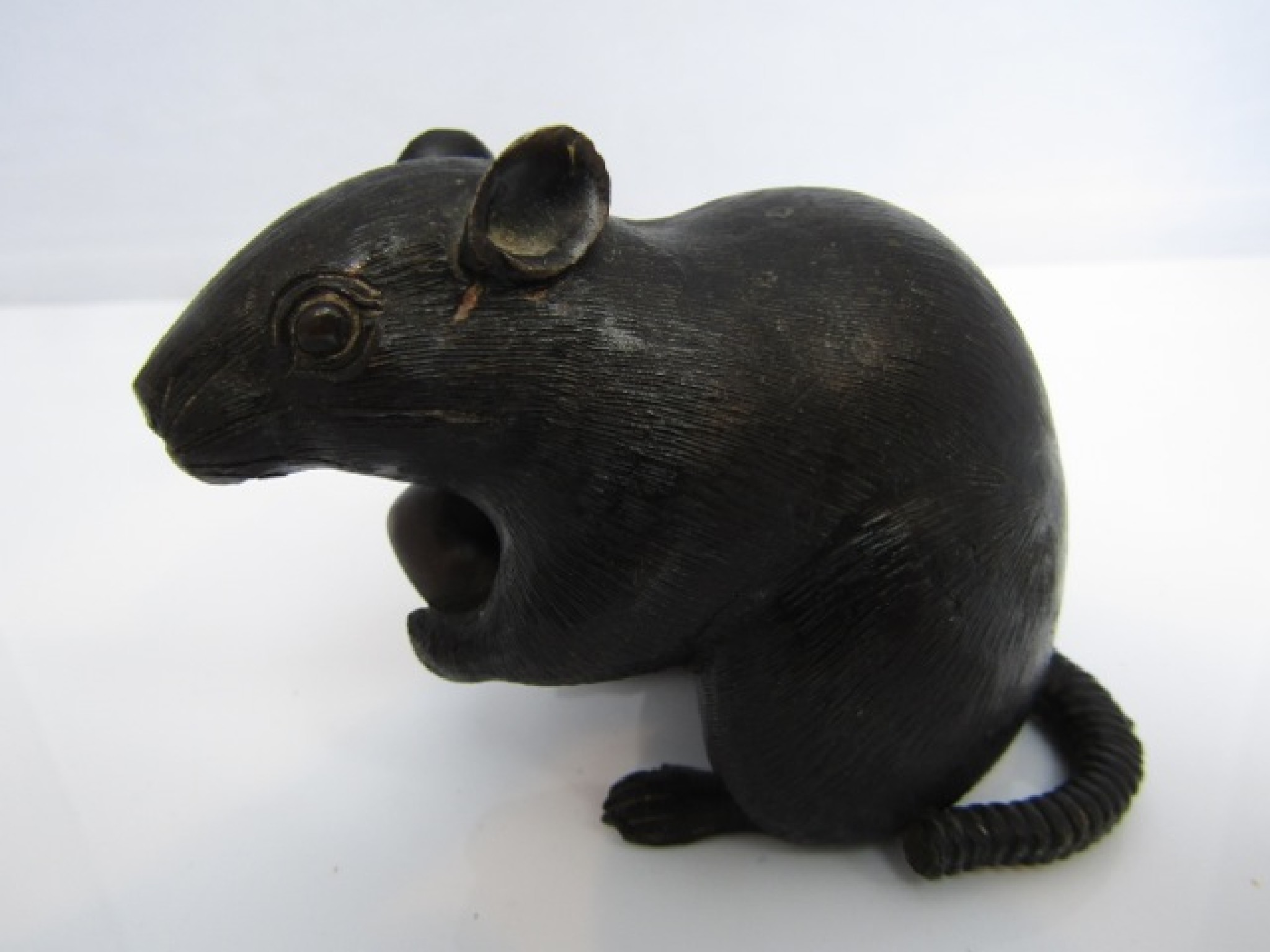 Appraisal: A Japanese bronze figure of a rat clasping a nut