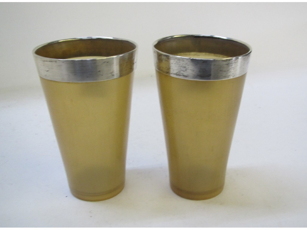 Appraisal: A pair of silver mounted horn goblets