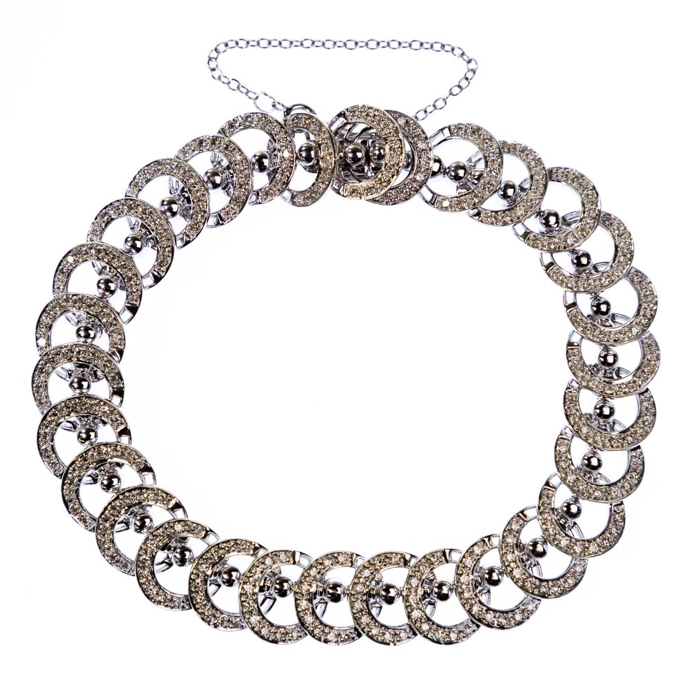 Appraisal: K WHITE GOLD AND DIAMOND BRACELETHaving diamond encrusted circles attached