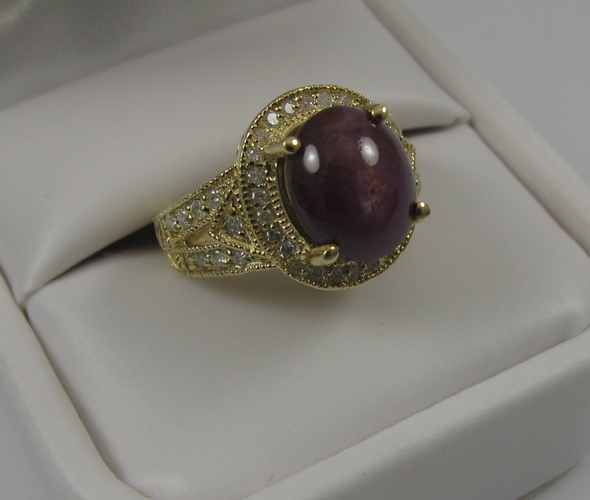 Appraisal: STAR RUBY DIAMOND AND K GOLD RING centering a ct