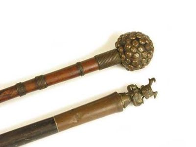 Appraisal: An African wood knobkerry with applied brass beads to the