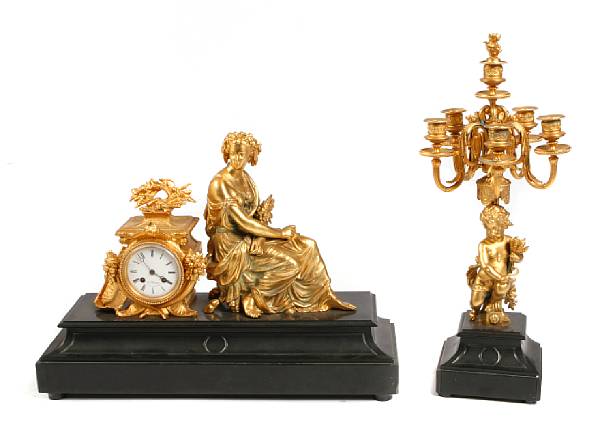 Appraisal: A French three piece gilt metal clock garniture clock measures