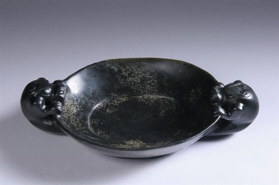 Appraisal: CHINESE BLACK JADE BOWL Qing Dynasty Oval-form flanked by two