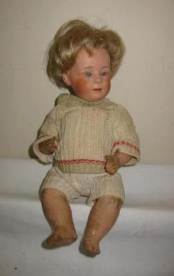 Appraisal: A Heubach bisque head character boy doll with grey sleeping