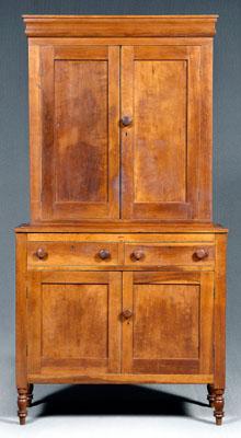 Appraisal: Kentucky cherry press cupboard ogee molded cornice above two frame-and-panel