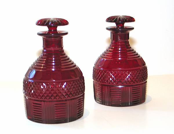 Appraisal: A pair of English ruby cut glass decanters th century