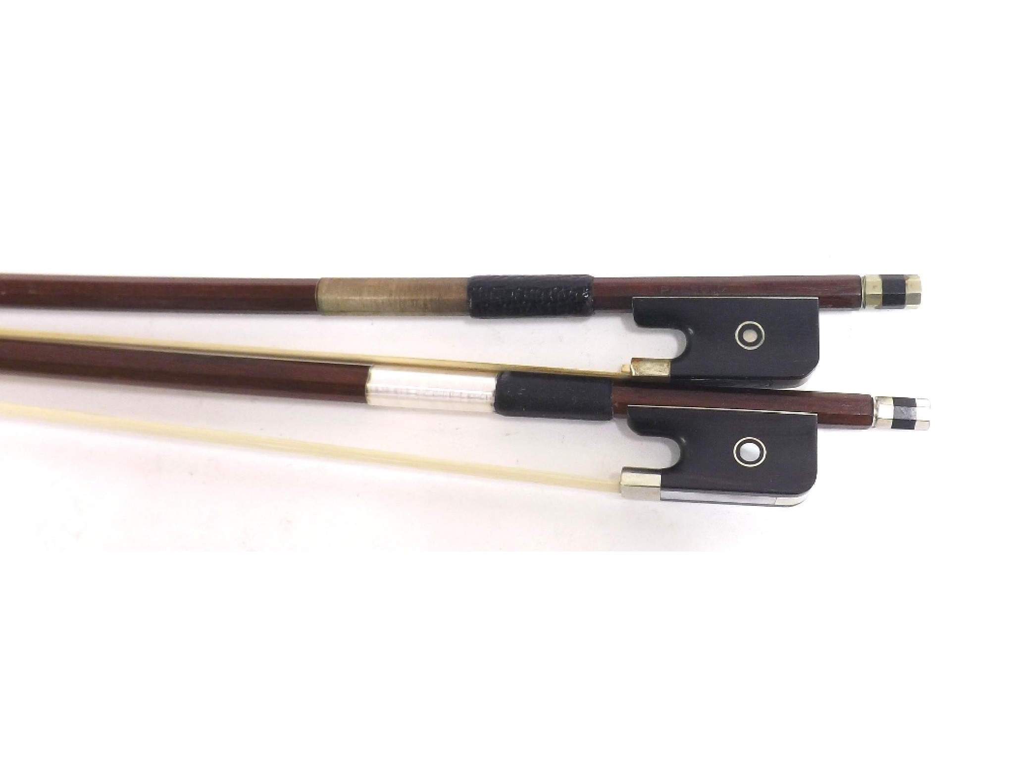 Appraisal: Nickel mounted viola bow stamped Paesold and a silver mounted