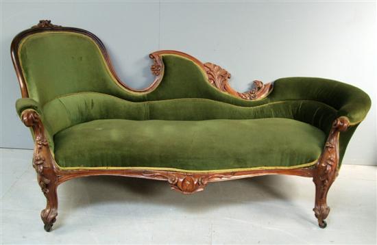 Appraisal: Victorian walnut chaise longue with foliate and floral carved decoration