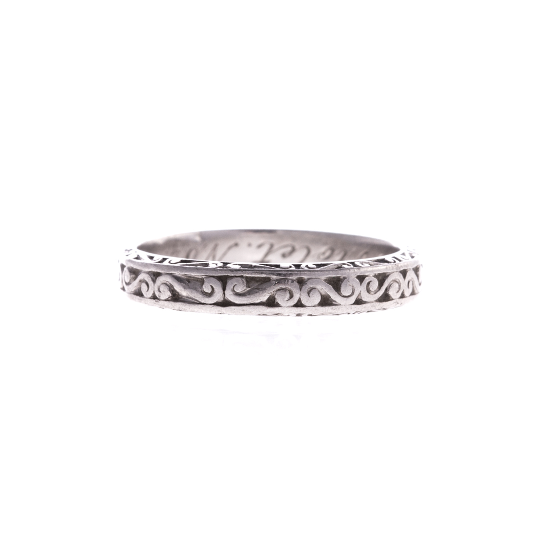 Appraisal: A Lady's Antique Platinum Wedding Band Platinum intricately engraved with