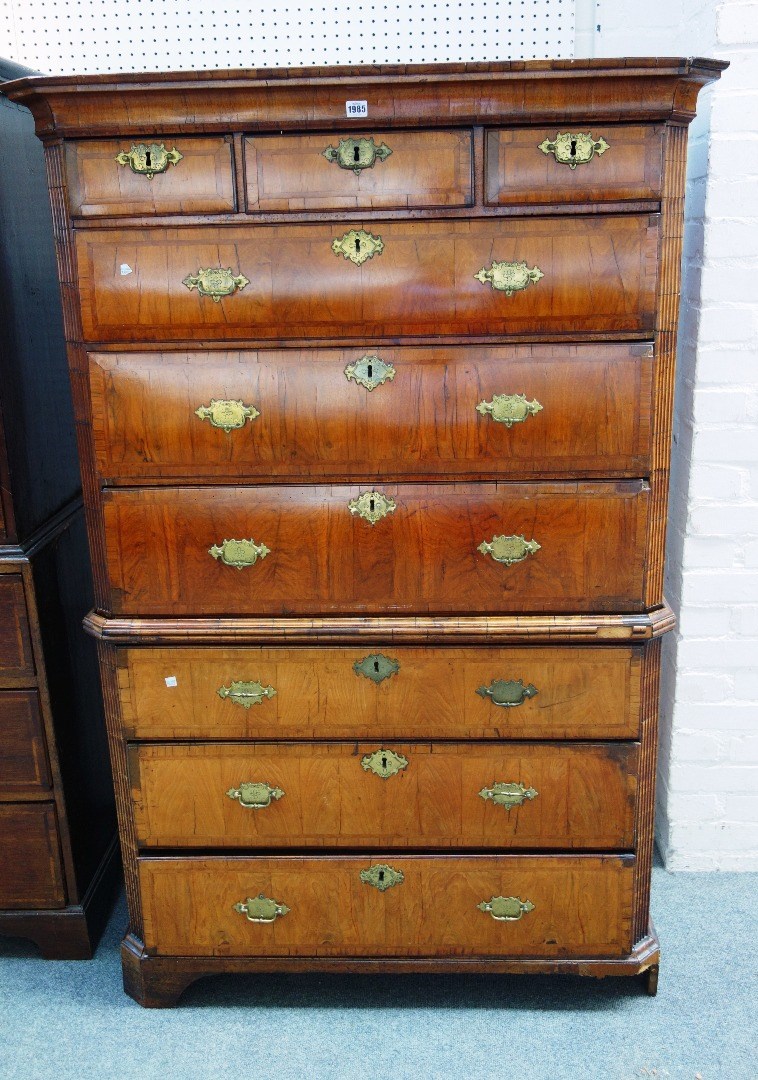 Appraisal: A mid th century feather banded walnut chest on chest