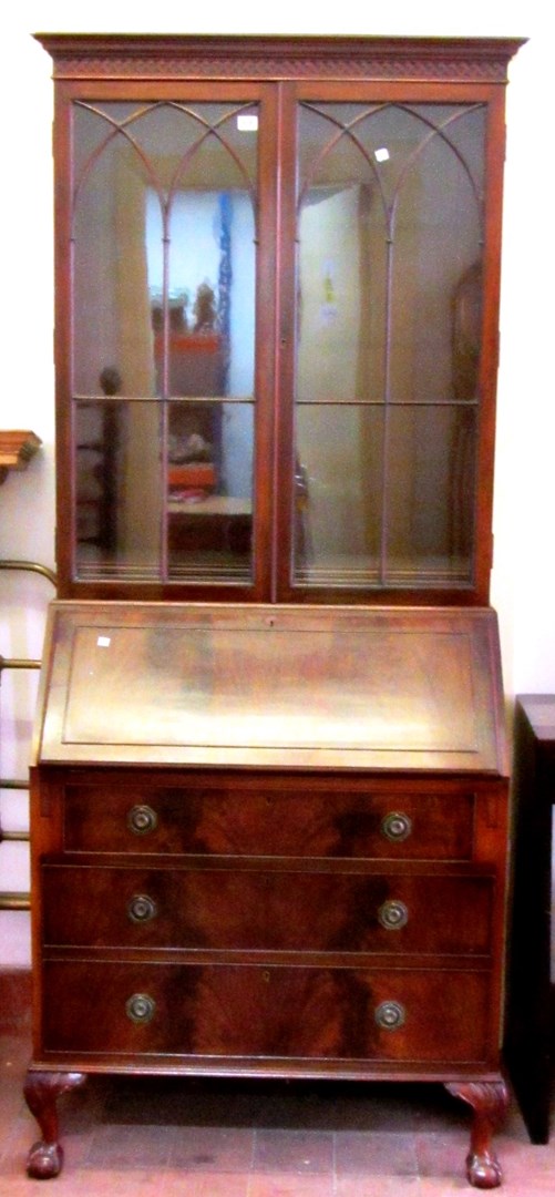 Appraisal: An Edwardian mahogany bureau bookcase the Gothic arched astragal glazed