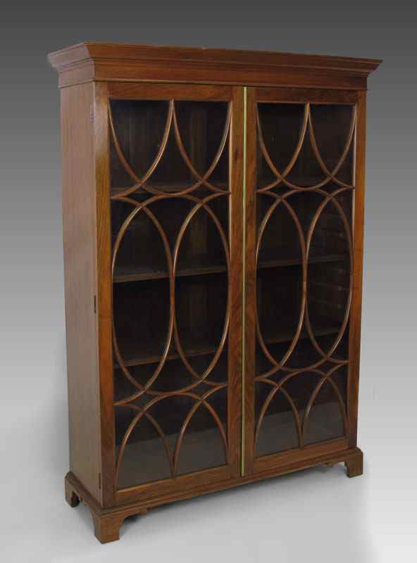 Appraisal: ENGLISH WALNUT DOOR BOOKCASE CA 'S Classic astragal glass doors