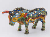 Appraisal: A ceramic model bull with multi coloured tile effect finish