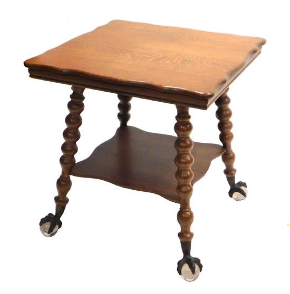 Appraisal: Center table c oak two shaped edge tiers splay turned