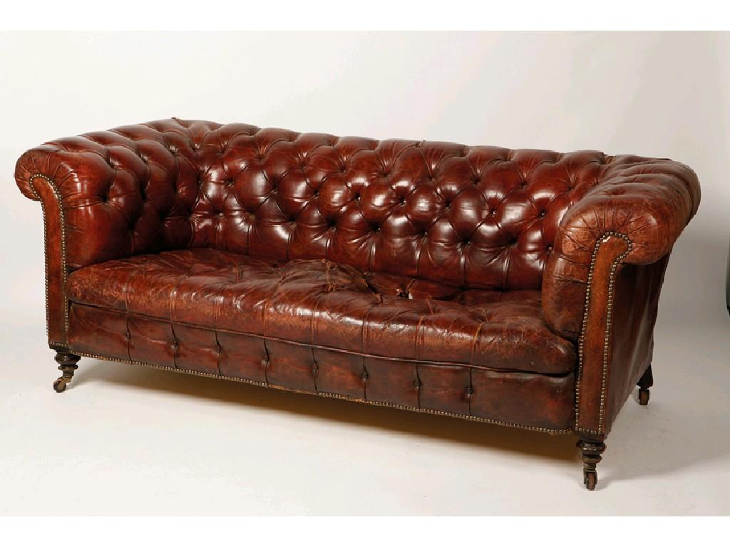 Appraisal: A VICTORIAN LEATHER UPHOLSTERED CHESTERFIELD SOFA the upholstered back and