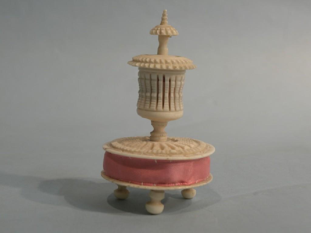 Appraisal: A Victorian carved and pierced ivory tape measure cm high