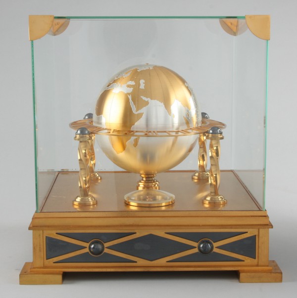 Appraisal: Clock featuring globe at center with major international cities marked