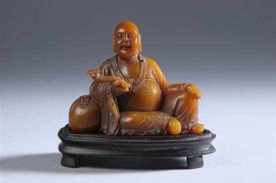 Appraisal: CHINESE SOAPSTONE FIGURE OF LOHAN Seated at ease holding a