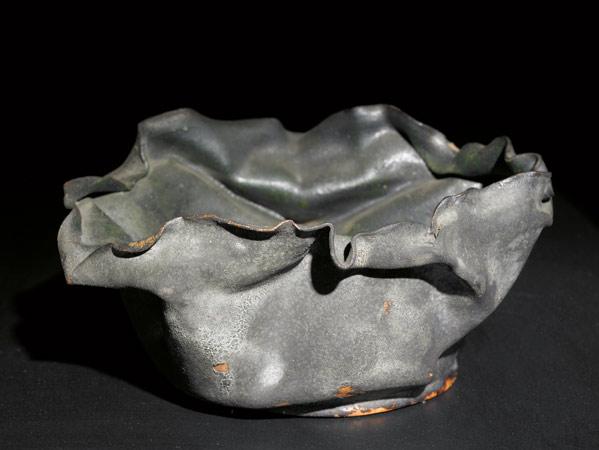 Appraisal: GEORGE OHR Large crumpled bowl covered in gun-metal and green