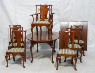 Appraisal: Cherry Dining Table Chairs arm and side chairs with shaped