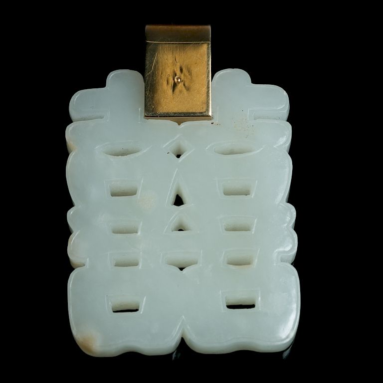 Appraisal: K MOUNTED WHITE JADE 'DOUBLE HAPPINESS' PENDANT The jade pendant