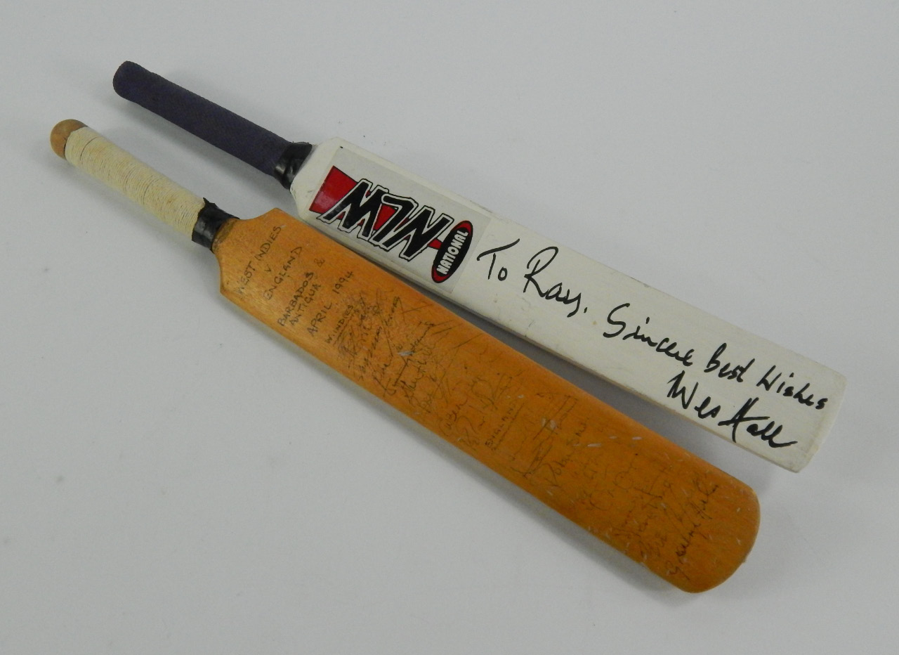 Appraisal: Two miniature cricket bats one ONLW signed To Ray sincere