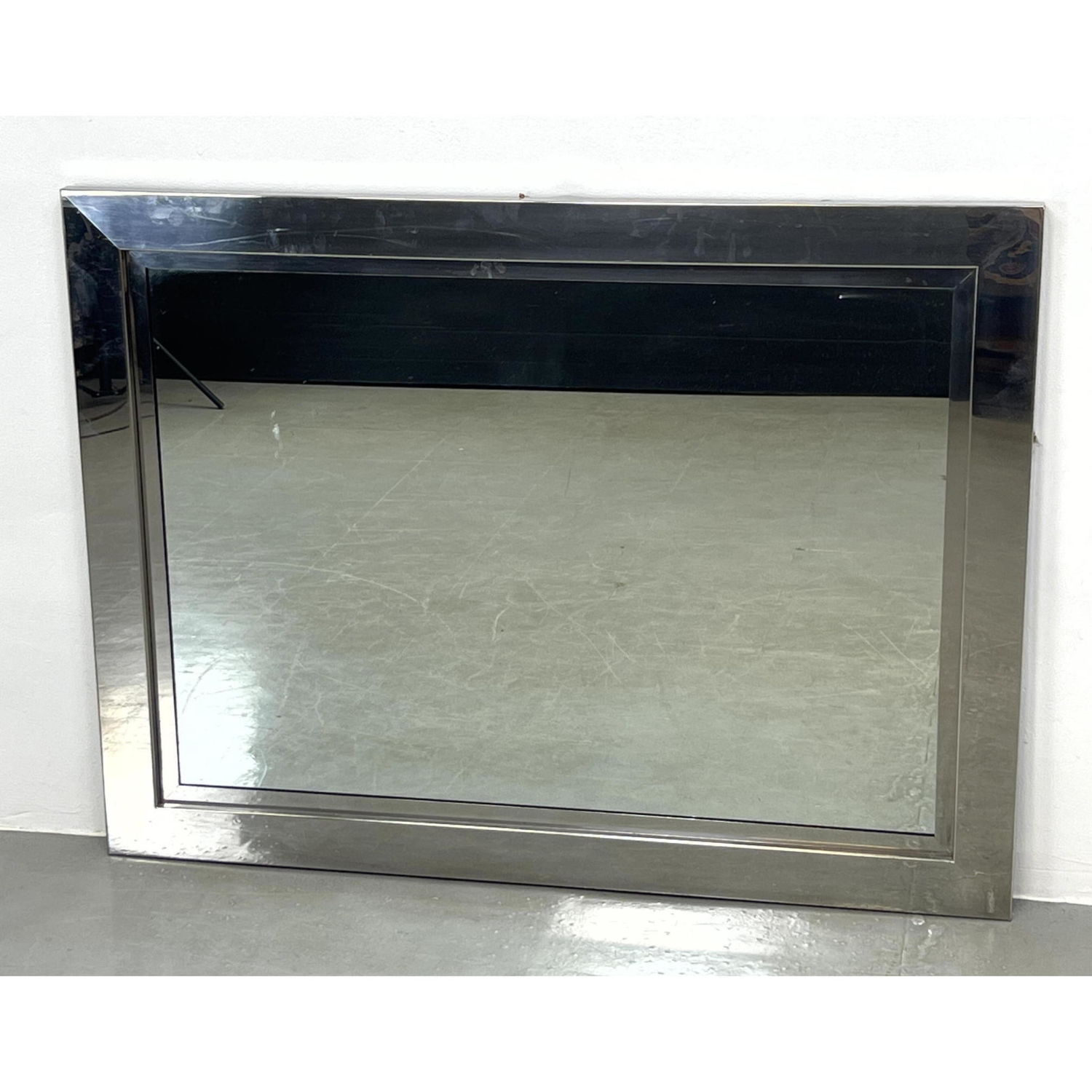 Appraisal: Stainless Steel framed Wall Mirror Dimensions H inches W inches