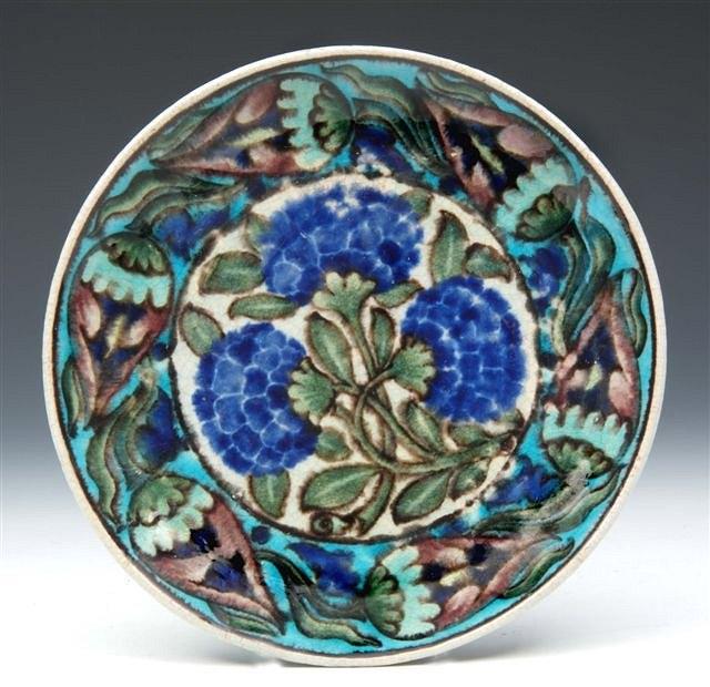 Appraisal: A WILLIAM DE MORGAN DISH decorated with central flowers within