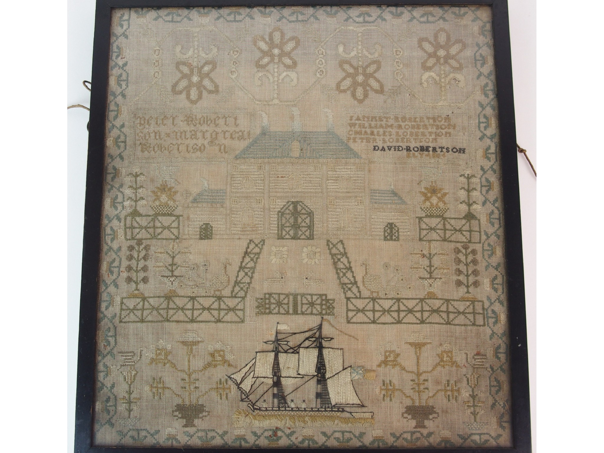 Appraisal: A framed early th Century samplershowing a house and garden