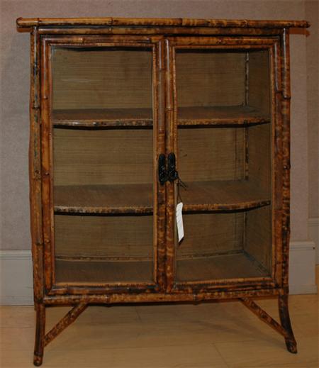 Appraisal: Regency Style Faux Bamboo Decorated Fruitwood Glazed Door Bookcase Estimate