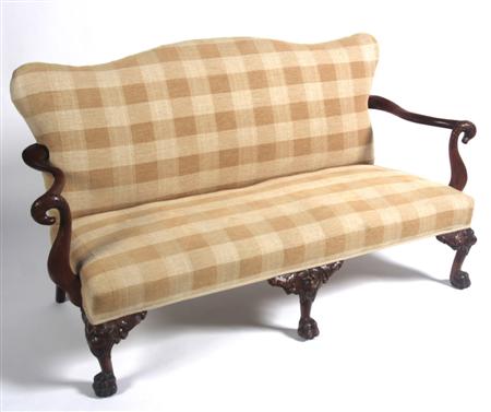 Appraisal: A George II style carved sofa the serpentine cushioned back