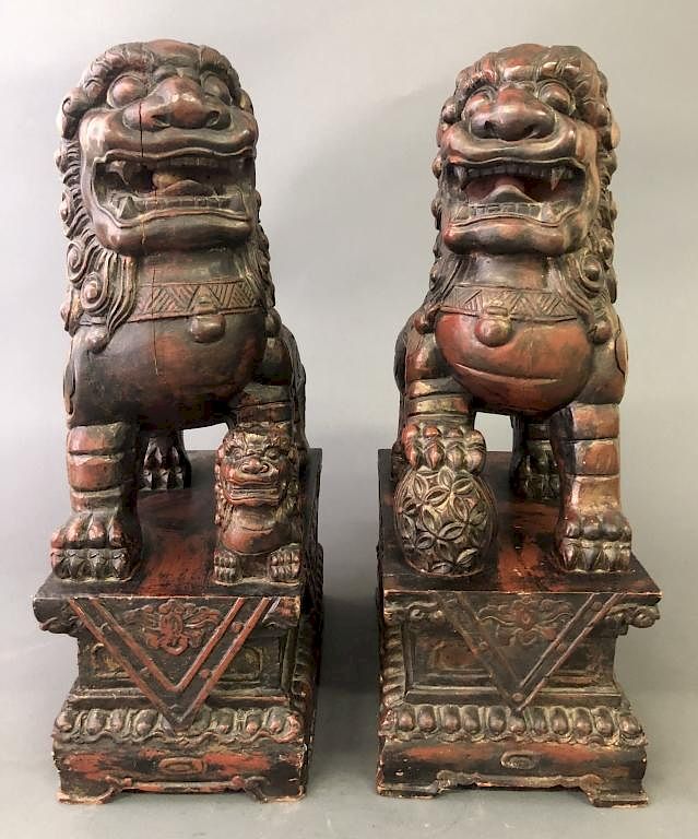 Appraisal: Pair of Wood Carved Seated Foo Dogs Pair of wood