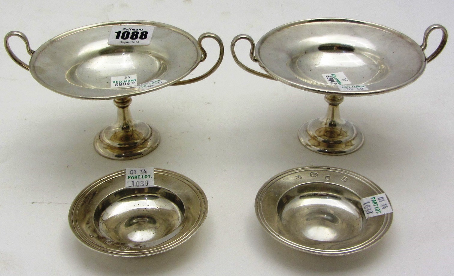 Appraisal: Two similar twin handled bonbon dishes of circular form on