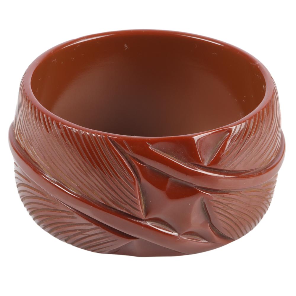 Appraisal: BROWN BAKELITE WIDE BANGLE BRACELET WITH CARVED FEATHER-LEAF DESIGN H