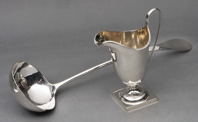 Appraisal: A GEORGIAN STYLE SILVER HELMET SHAPED CREAM JUG high Chester