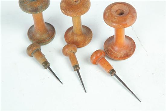 Appraisal: THREE SHAKER SPOOLS WITH AWLS American th century maple Applecore