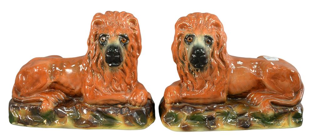 Appraisal: Pair of Staffordshire Recumbent Lions having inset glass eyes and