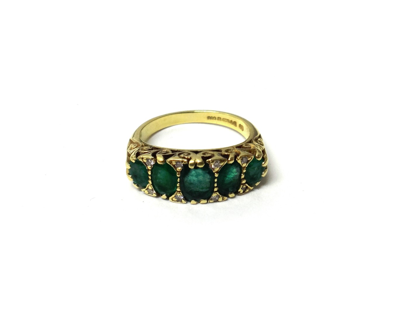 Appraisal: An ct gold emerald and diamond ring mounted with a