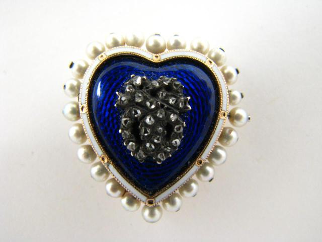 Appraisal: Unstamped yellow gold lady's heart pin x mm containing blue