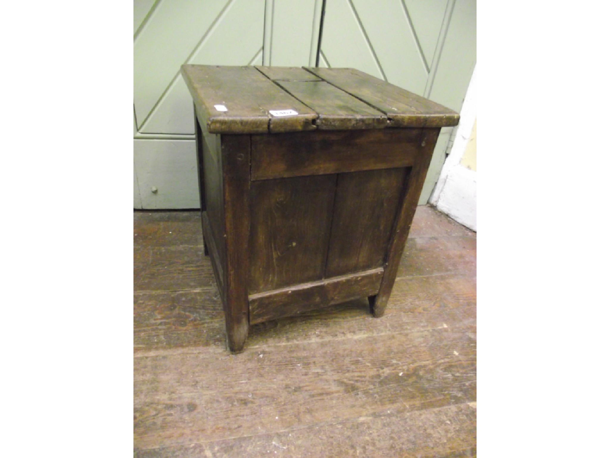 Appraisal: A primitive box with panelled framework and plank top