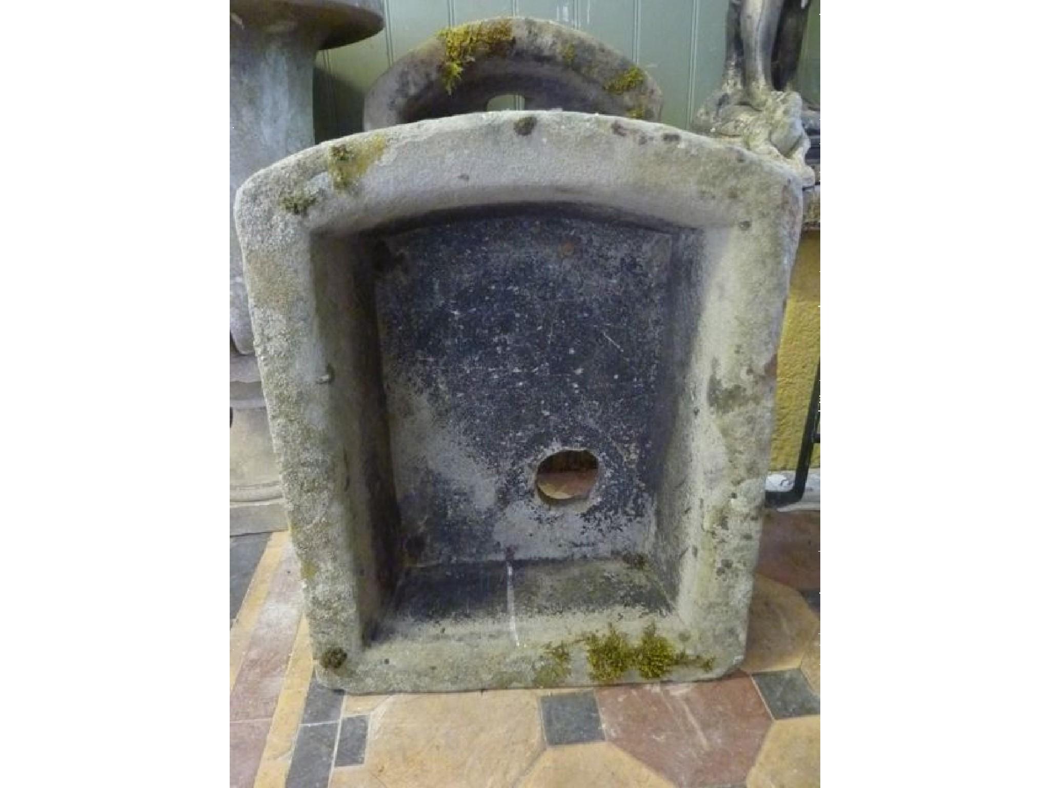 Appraisal: A weathered natural stone D end garden trough slightly smaller