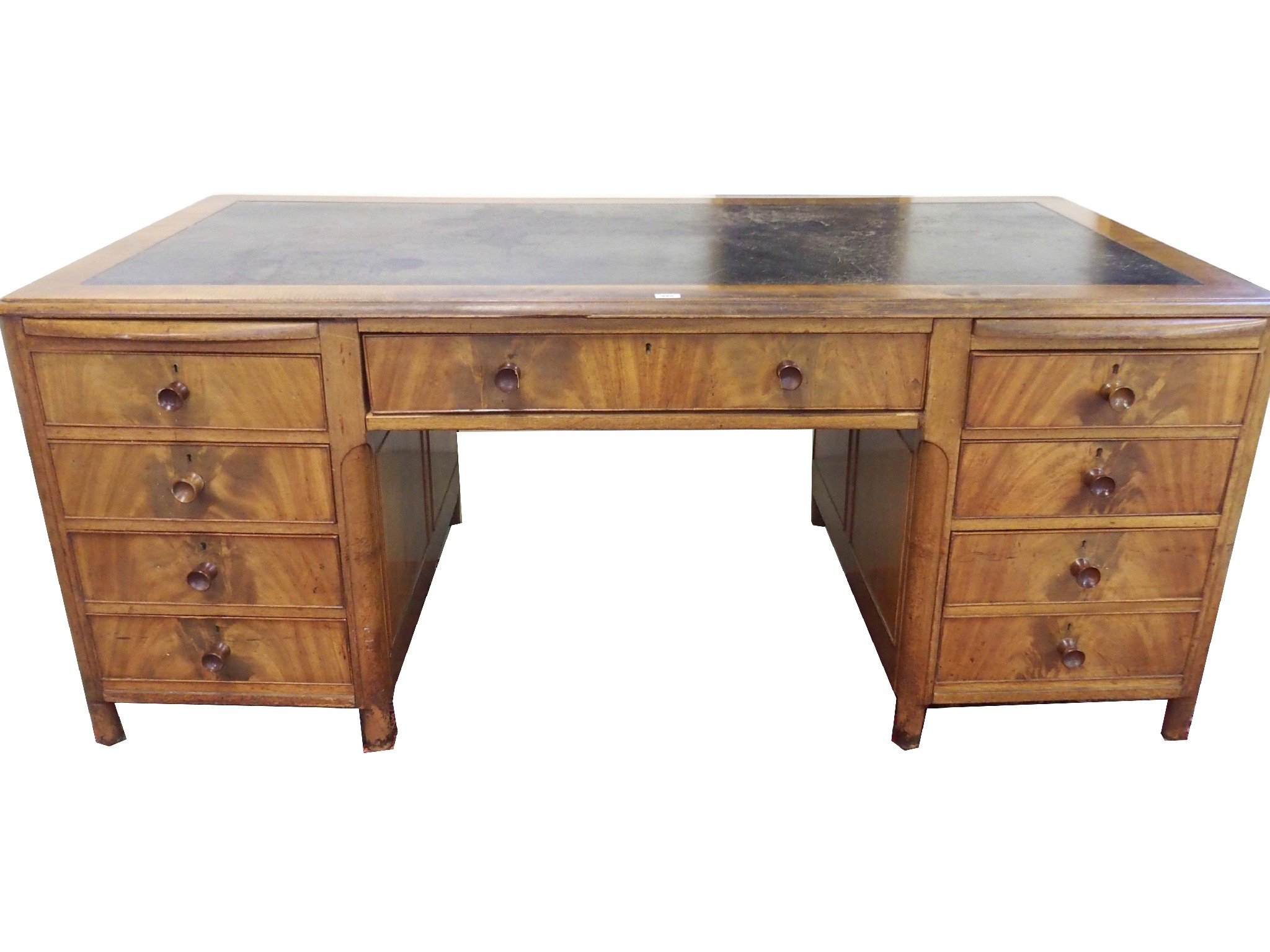 Appraisal: A mahogany pedestal office deskwith central drawer and flanked by