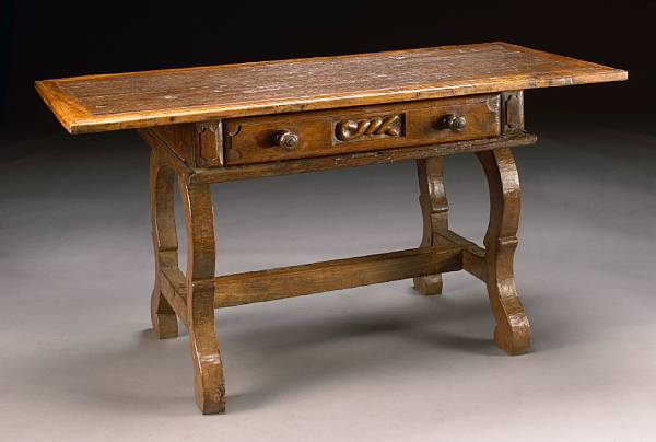 Appraisal: A Spanish Baroque style mixed wood table incorporating antique and