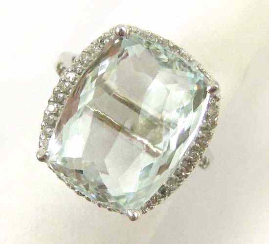 Appraisal: AQUAMARINE AND DIAMOND RING k white gold with round full-cut