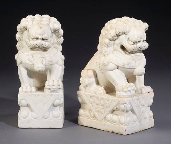 Appraisal: A pair of contemporary carved marble fu lions One lion