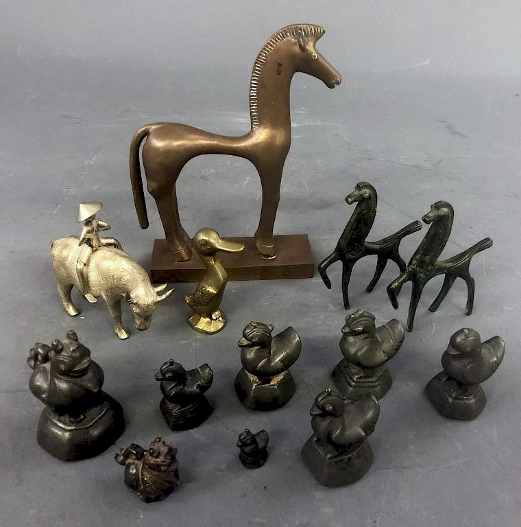 Appraisal: Thirteen Metal Animals Thirteen metal animals to include a Russian