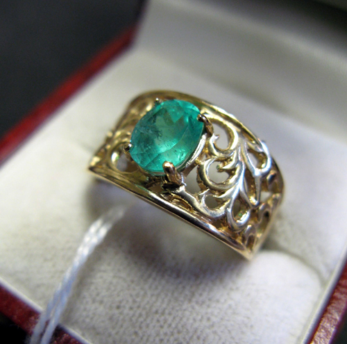 Appraisal: EMERALD AND FOURTEEN KARAT GOLD SOLITAIRE RING set with a