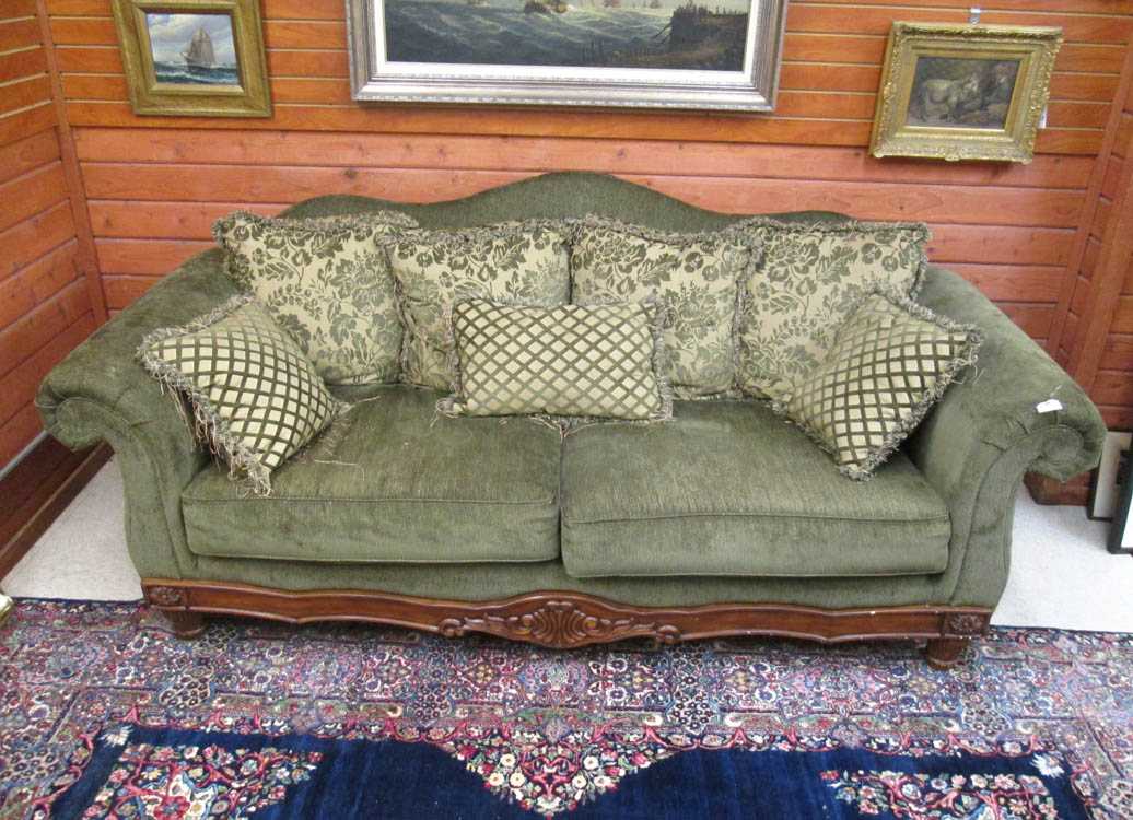 Appraisal: GREEN UPHOLSTERED AND CARVED MAHOGANY FINISH SOFA Ashley Furniture Industries