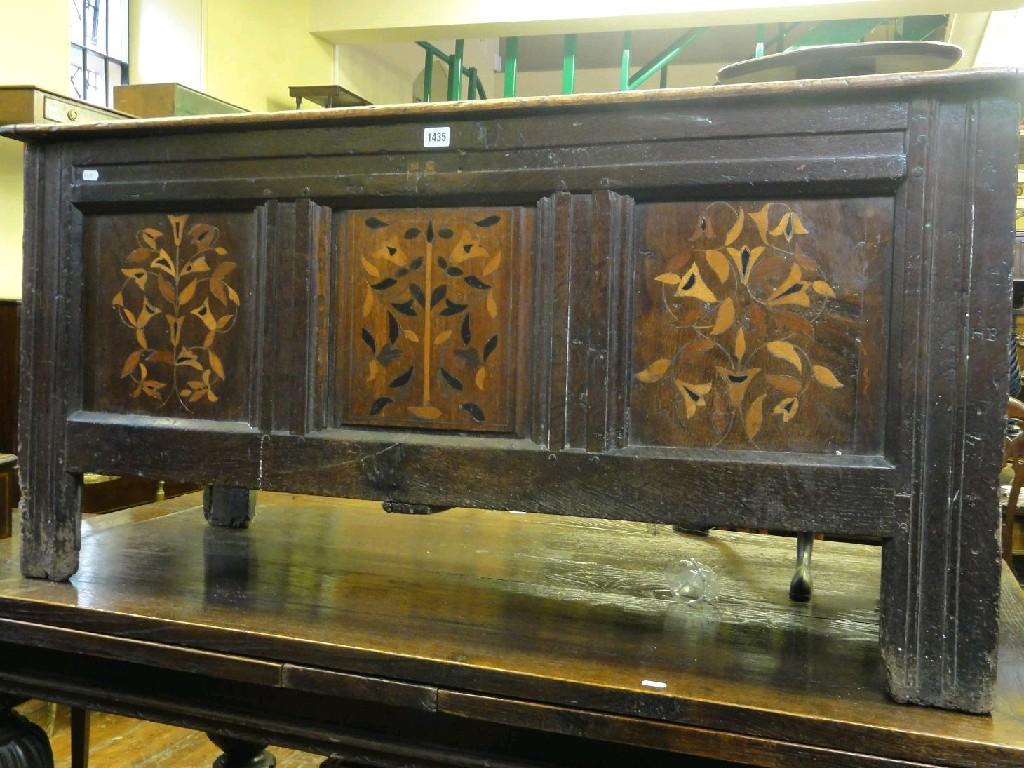 Appraisal: A th century oak coffer with panelled frame and moulded