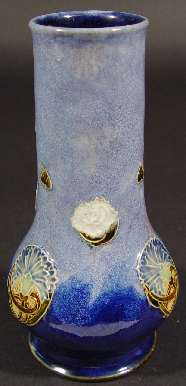 Appraisal: Royal Doulton stoneware vase relief moulded with flowers onto a